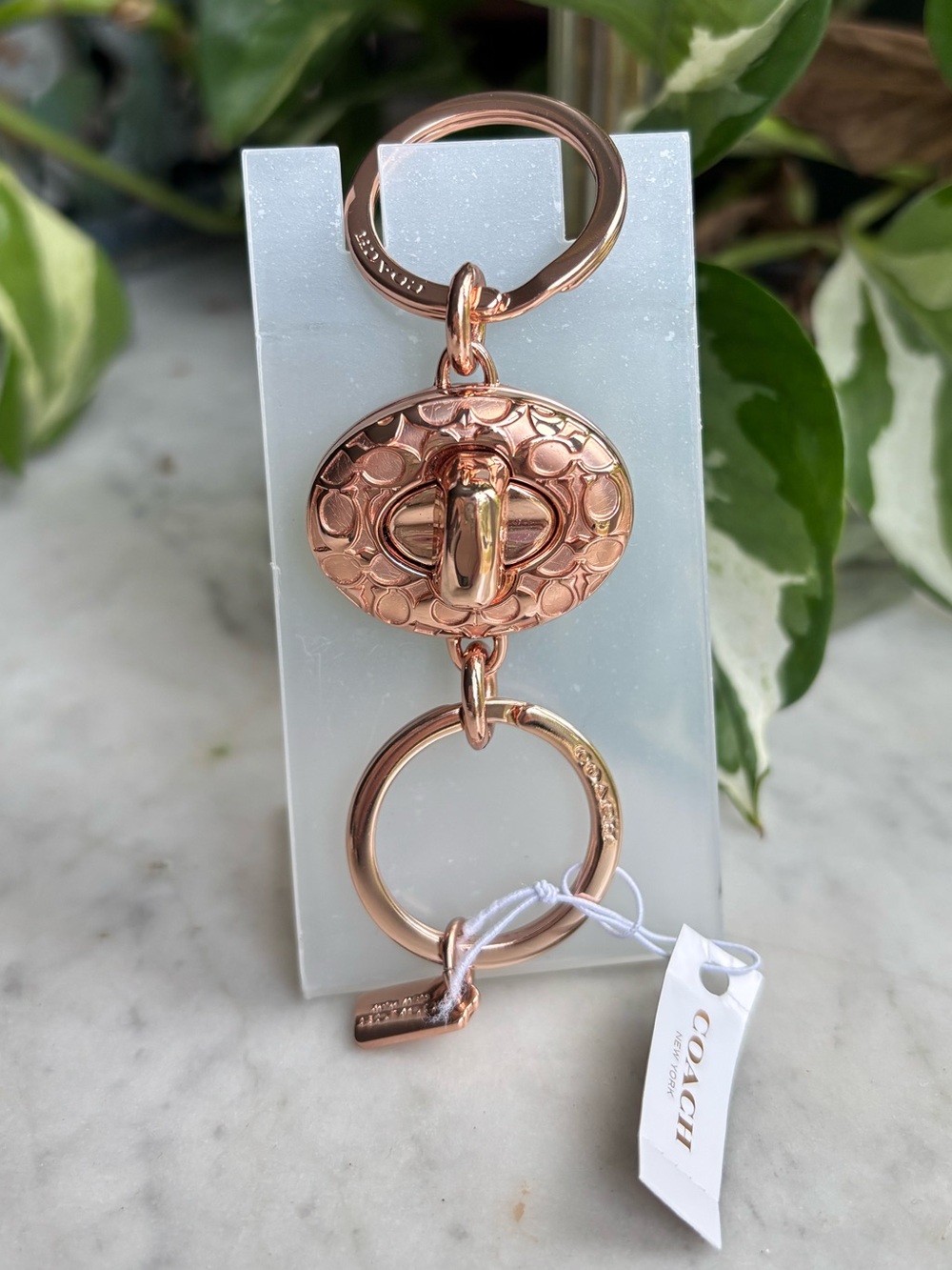 Coach Rose Gold Signature Turn Lock Keyring